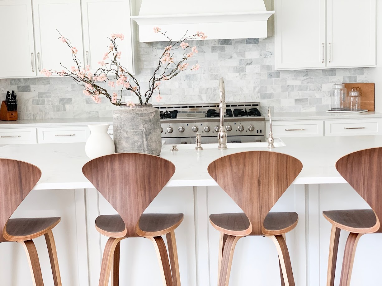 waterstone, faucet, counter stools, wood stools, wood and white, white kitchen 