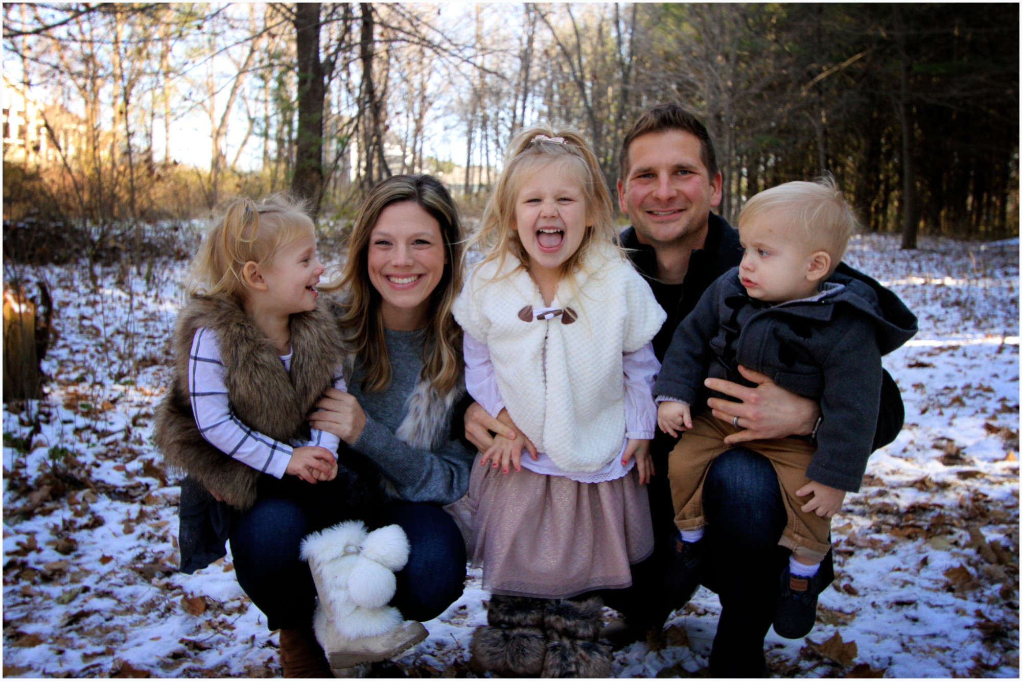 family in woods three kids