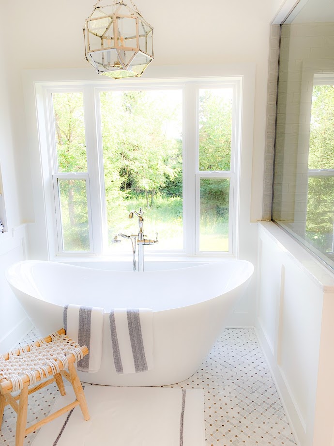 morris chandelier hung over bath tub 