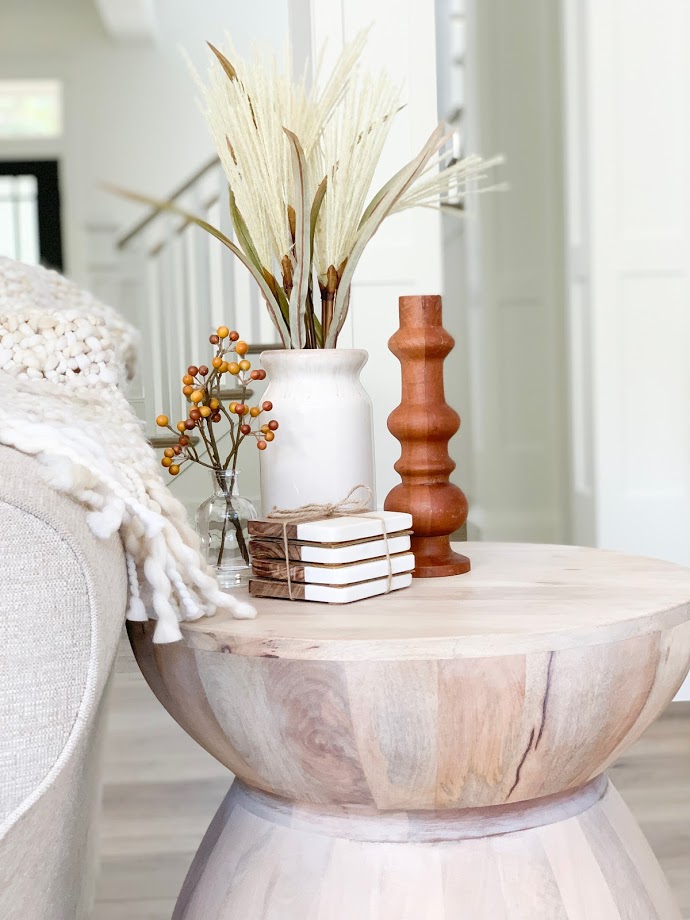 wood end table with fall decor, vase with spray