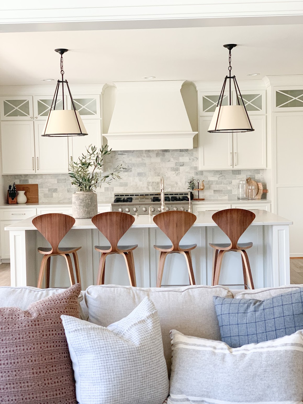 view into kitchen with pillows